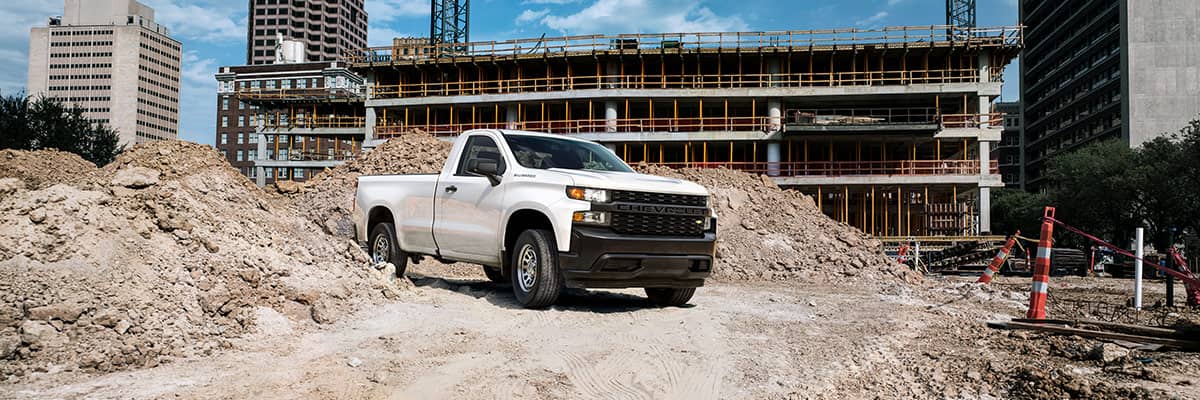 Chevrolet Silverado driving through a construction worksite